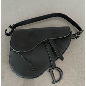 Women’s Authentic Christian Dior Saddle Bag.